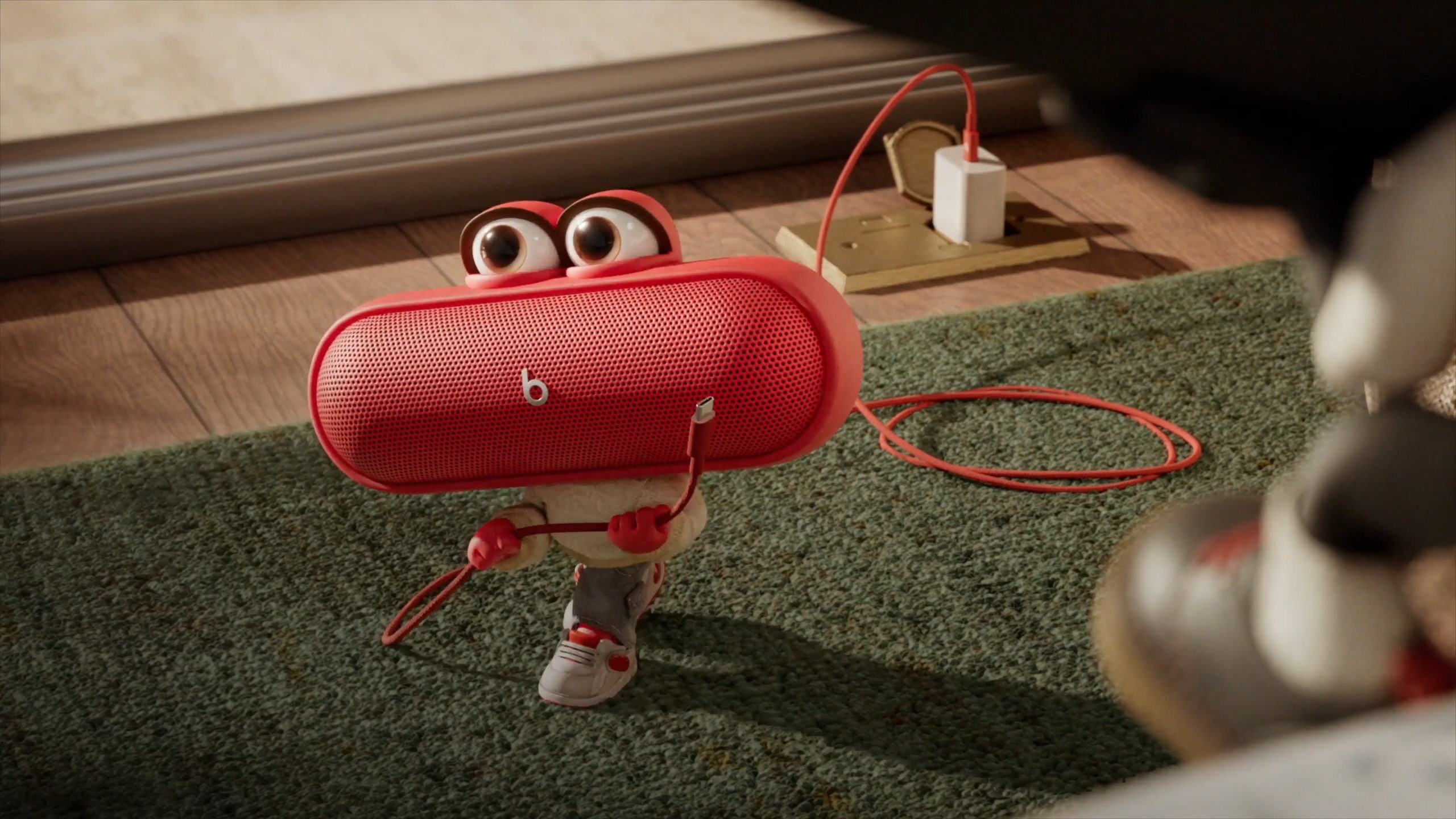 Beats Pill People character shown with Beats Charging Cables.