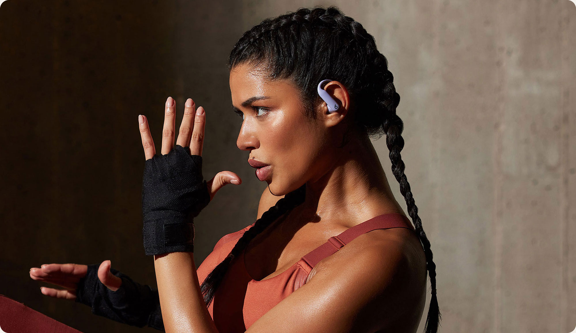 Person wearing Powerbeats Pro 2 earbuds