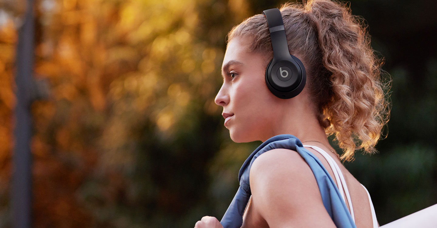 Woman wearing Solo 4 headphones